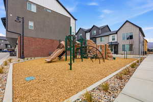 Community playground featuring a residential view
