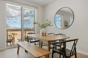 Dining area with baseboards and light wood-style floors