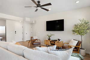 Living room featuring recessed lighting, ceiling fan, and wood finished floors