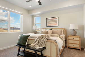 Bedroom with dark carpet and ceiling fan