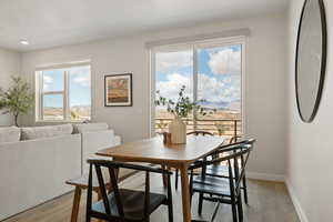 Dining room with light wood-style flooring and baseboards