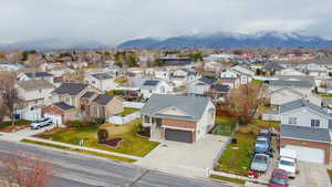 Aerial view of residential area featuring mountains