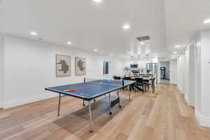 Recreation room featuring recessed lighting and light wood-style floors
