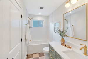 Full bathroom featuring vanity and shower / bath combination