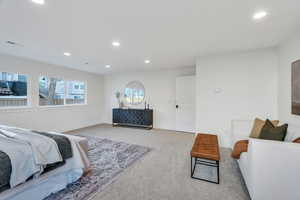 Carpeted bedroom featuring recessed lighting and baseboards