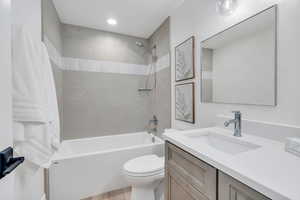 Full bath featuring washtub / shower combination and vanity