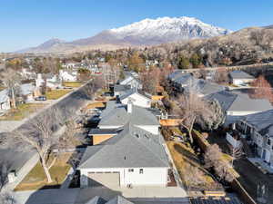 Aerial view of property's location featuring nearby suburban area and mountains
