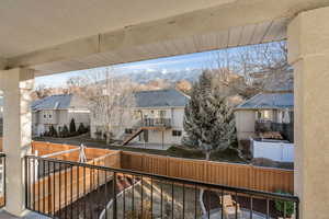 Balcony with a mountain view, a residential view, and stairs