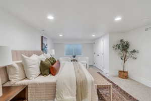Carpeted bedroom featuring baseboards and recessed lighting