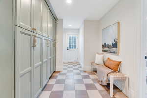 Mudroom featuring recessed lighting and light floors