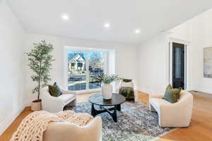 Sitting room featuring wood finished floors and recessed lighting