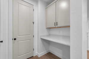 Unfurnished office with light wood-type flooring and baseboards