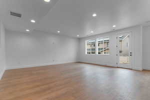 Spare room featuring recessed lighting and light wood-style flooring