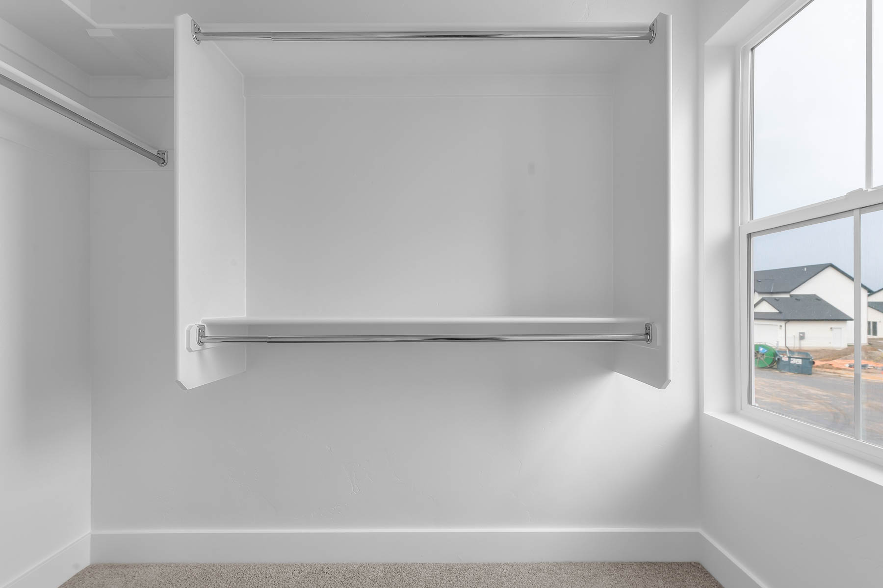 Walk in closet featuring carpet floors