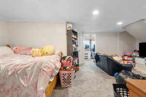 Bedroom featuring light carpet and recessed lighting