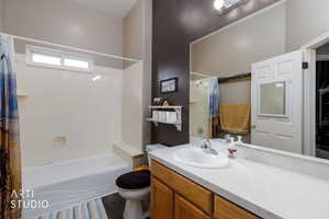 Bathroom with vanity and shower / bath combination with curtain