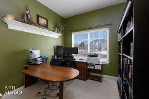 Office space featuring light carpet and baseboards