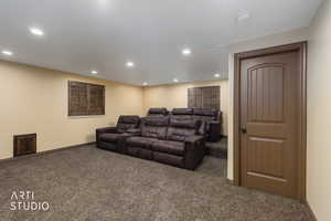Cinema featuring carpet floors and recessed lighting