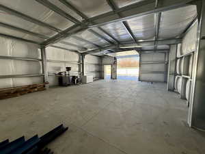 Garage featuring metal wall