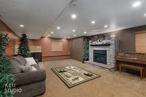 Living area featuring a fireplace, light carpet, and recessed lighting