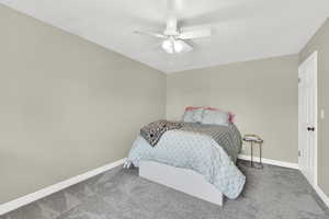 Bedroom with carpet and ceiling fan