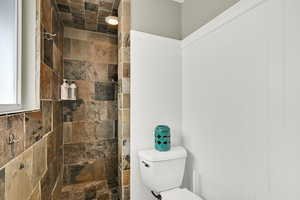 Bathroom featuring toilet and walk in shower