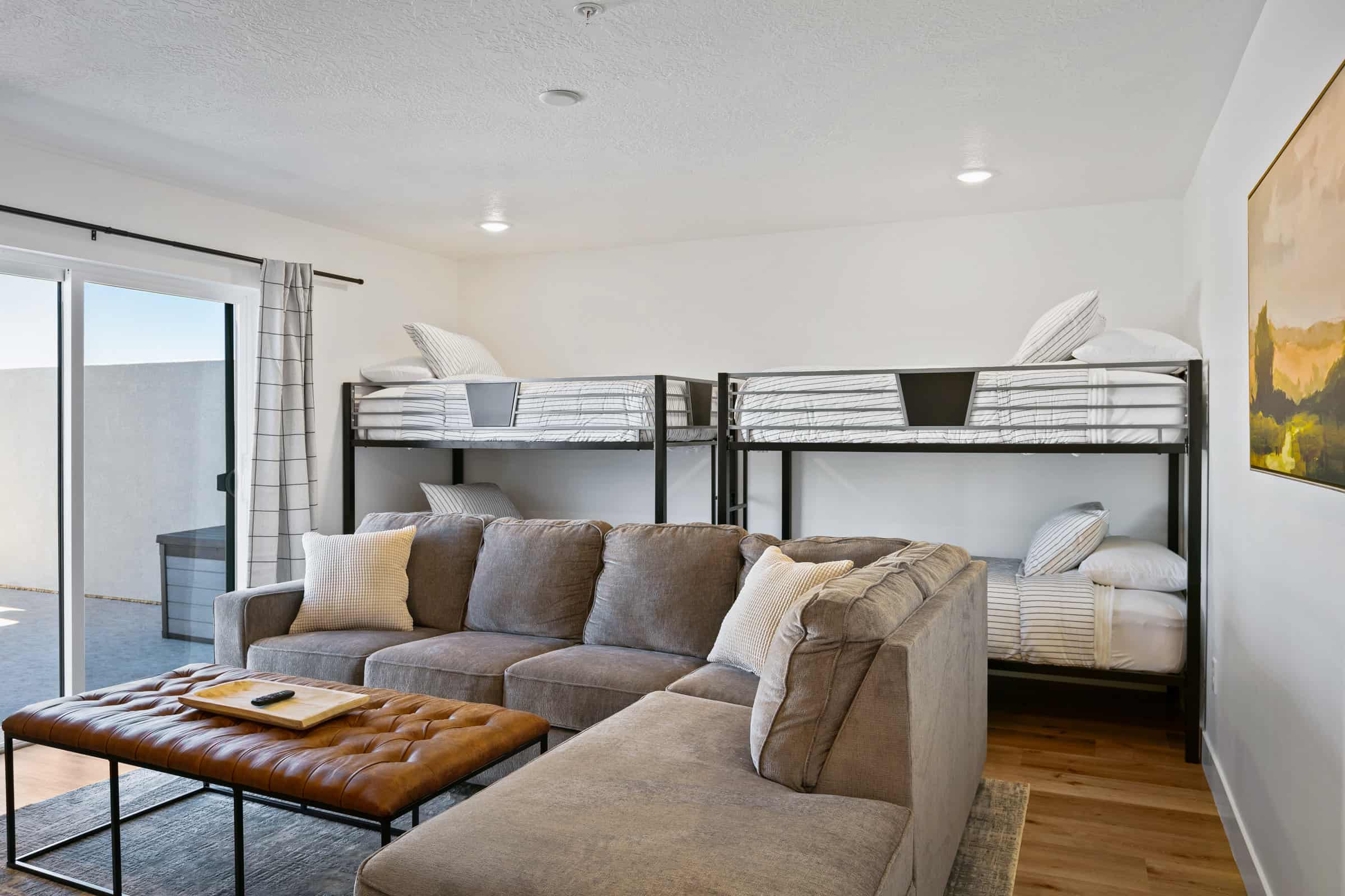 Bedroom featuring wood finished floors, access to outside, and a textured ceiling