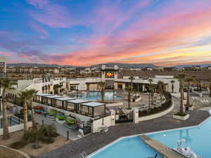 Aerial view at dusk of view of pool and a mountain view