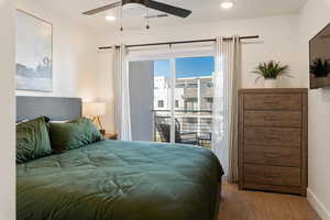 Bedroom featuring carpet, access to exterior, a ceiling fan, and recessed lighting