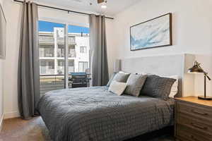 Bedroom with dark colored carpet, recessed lighting, and ceiling fan
