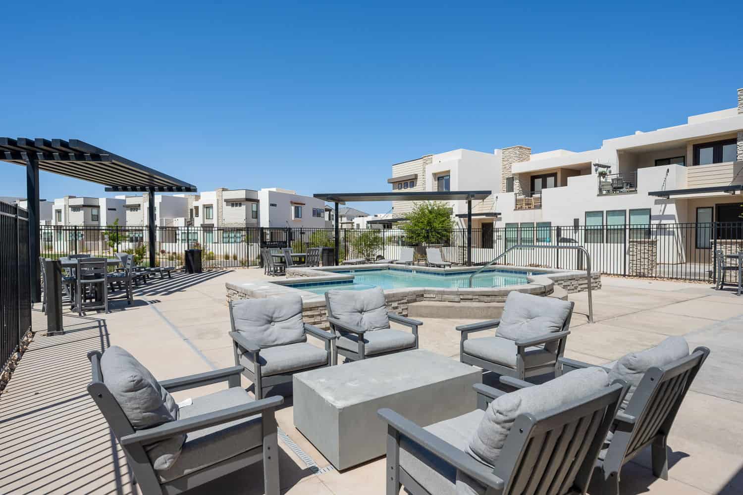 Community pool featuring a patio, a pergola, and outdoor lounge area