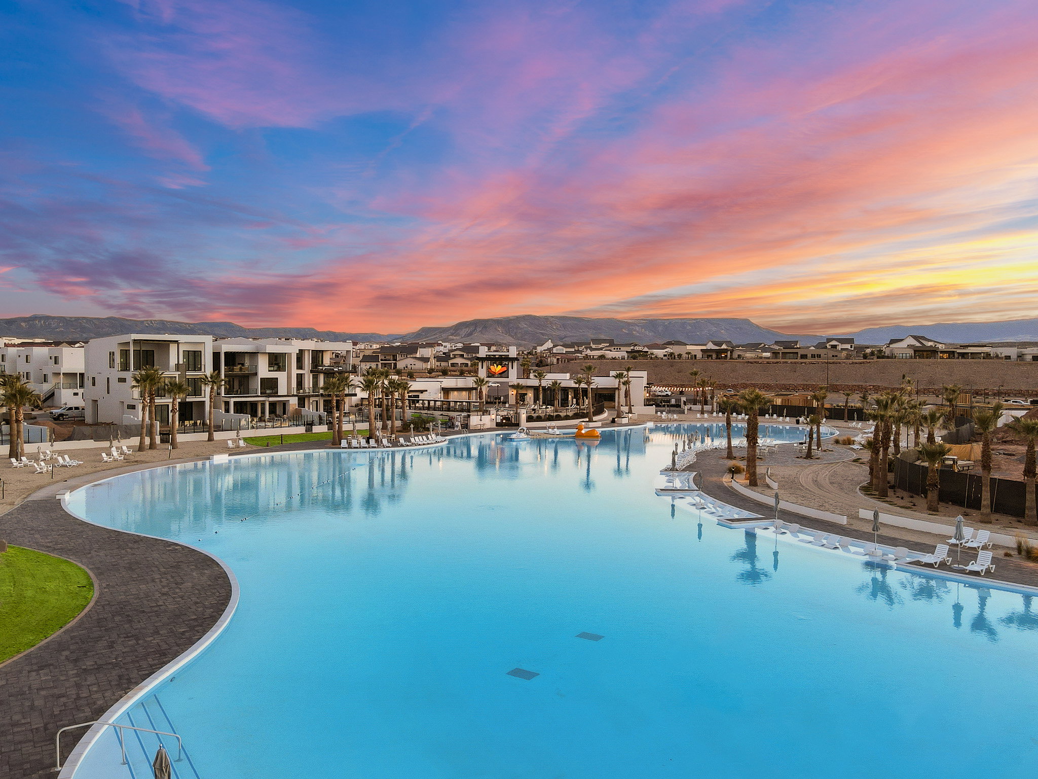 Community pool featuring a mountain view and a patio