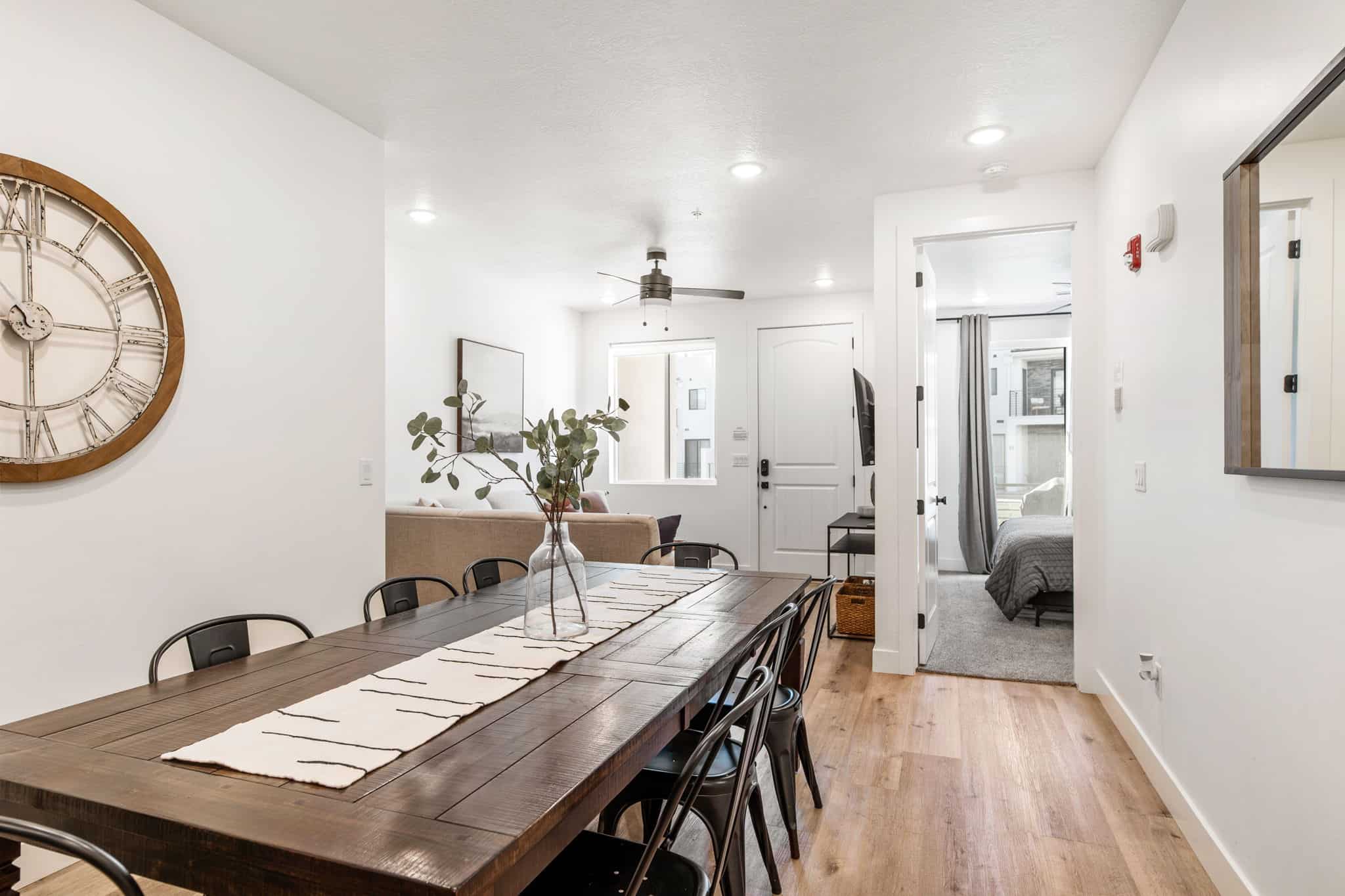 Dining space with light wood finished floors, a ceiling fan, and recessed lighting