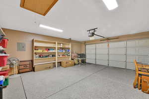 Garage featuring electric panel