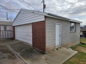 View of detached 2 car garage with opener