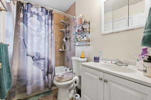 Bathroom featuring vanity and shower / tub combo