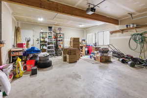 Garage featuring a garage door opener