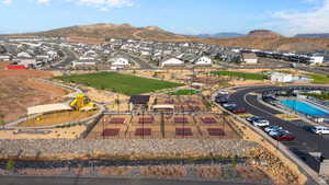 Aerial perspective of suburban area with a mountainous background