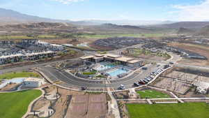 Aerial overview of property's location featuring a pool and mountains