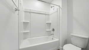 Full bath with tub / shower combination and toilet