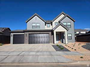 Modern farmhouse with concrete driveway and a garage