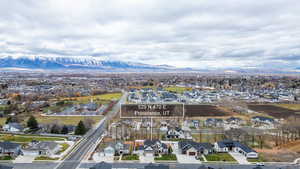 Aerial view of residential area featuring a mountain backdrop