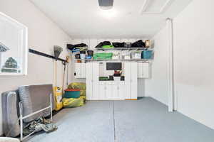 Garage featuring a garage door opener