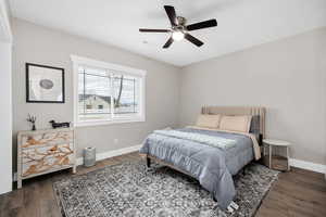 Bedroom featuring dark wood finished floors and ceiling fan