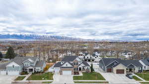 Aerial perspective of suburban area featuring a mountain backdrop