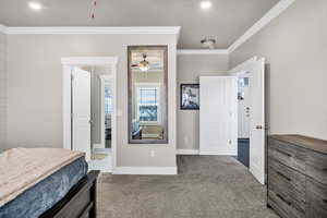 Master bedroom with ornamental molding and ceiling fan