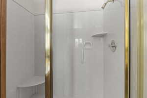 Full bathroom featuring a stall shower