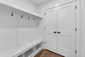 Mudroom with dark wood-style floors