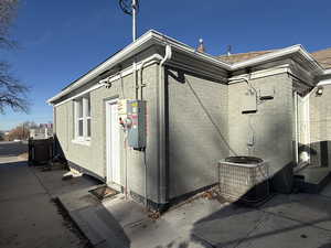 View of side of home featuring a central AC unit