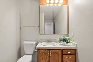 Bathroom featuring vanity and a textured wall